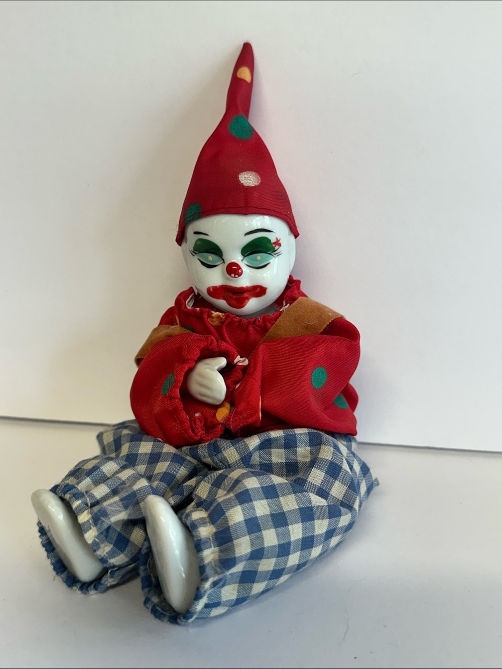 Vintage Porcelain Clown Doll in Red Hat and Checked Pants